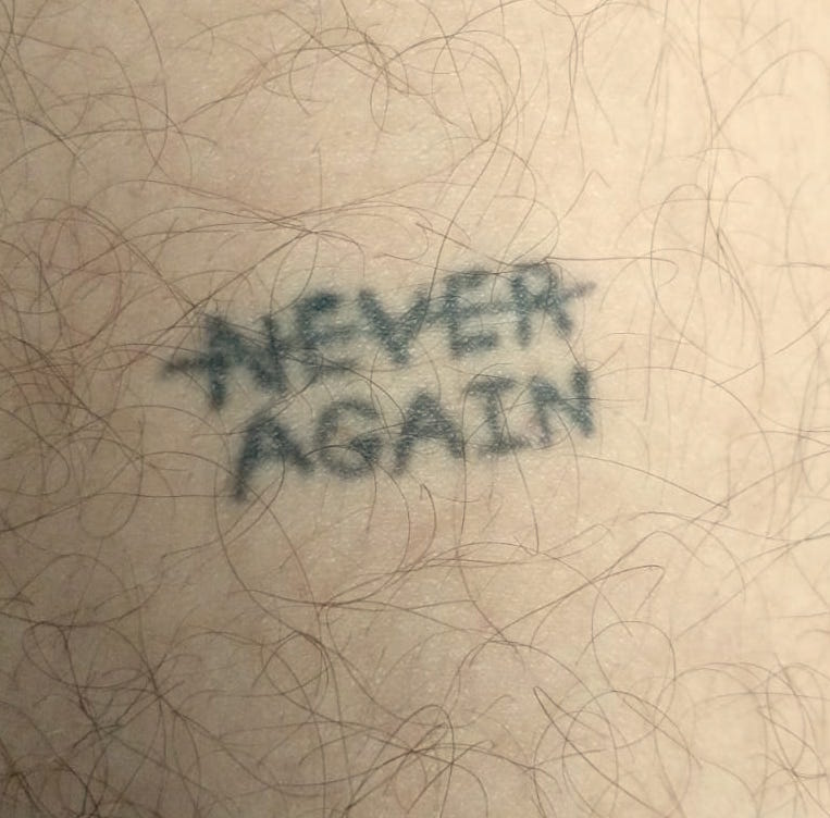 Never Again tattoo